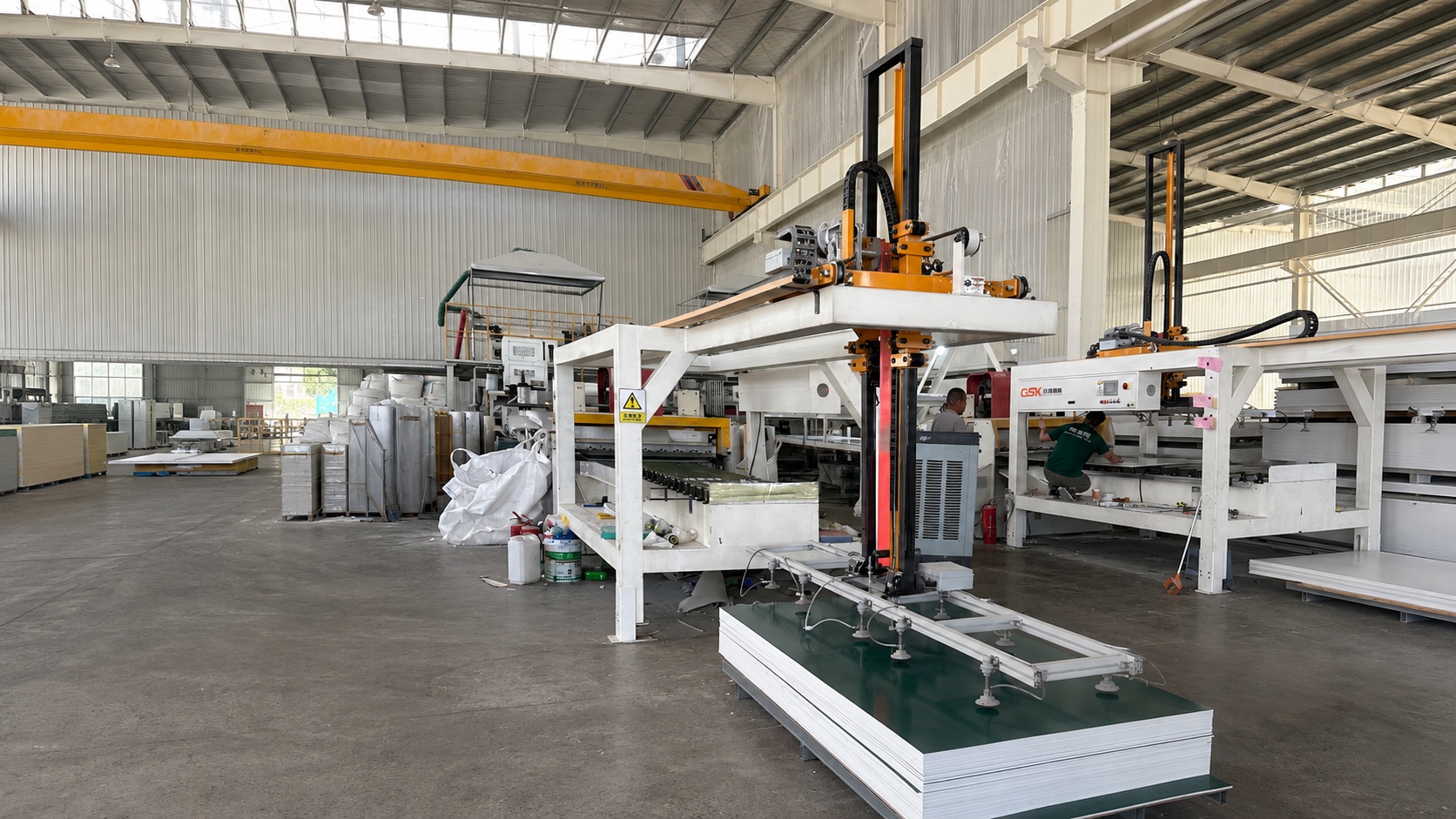 SPC stone crystal wall panel handling line inside the VIGOU factory